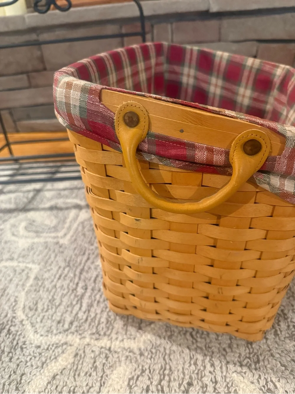 Longaberger newspaper basket. With lid , liner and wrought iron stand